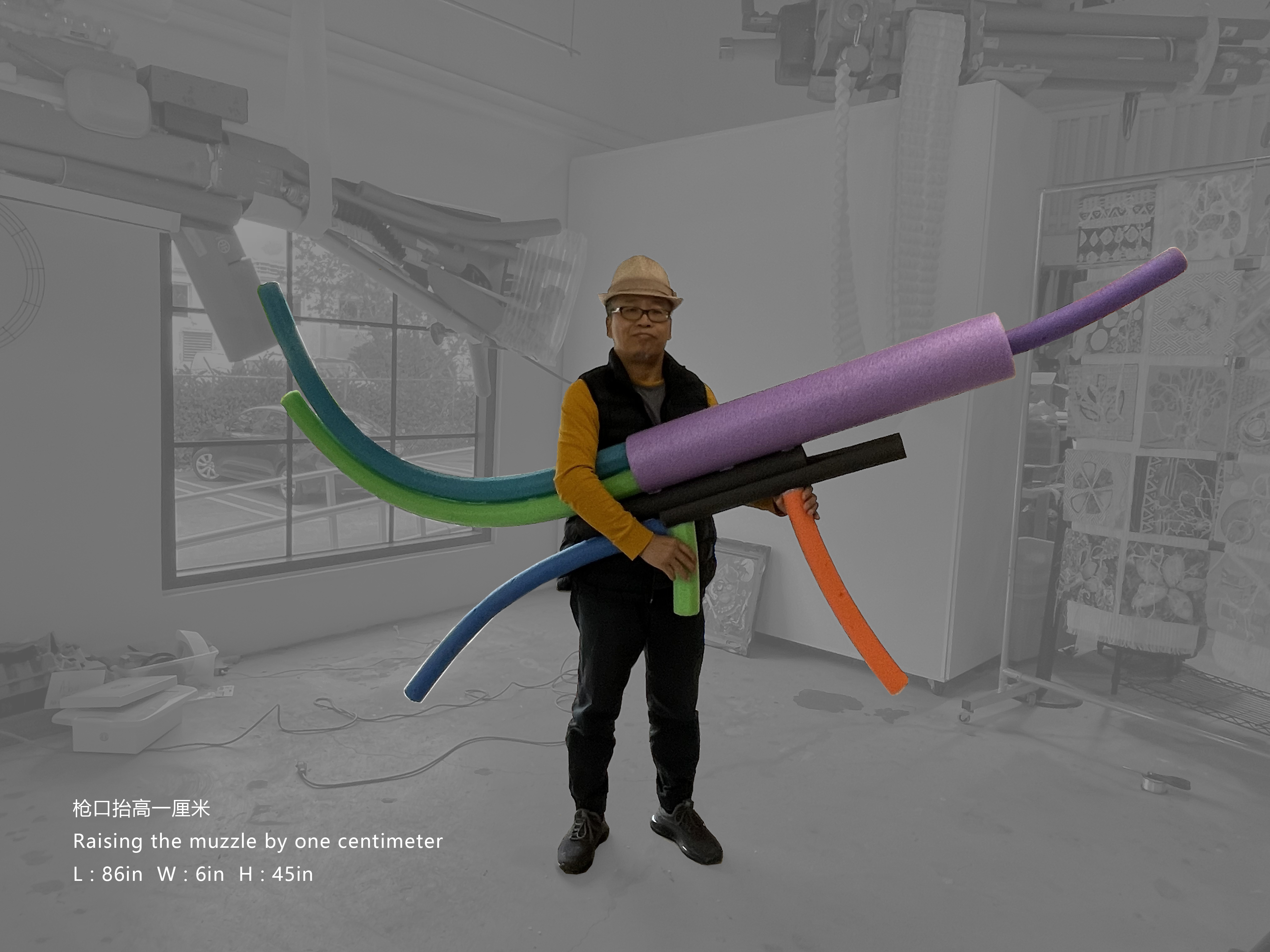Zhongguo Zheng holding a large brightly colored sculpture made from polystyrene foam